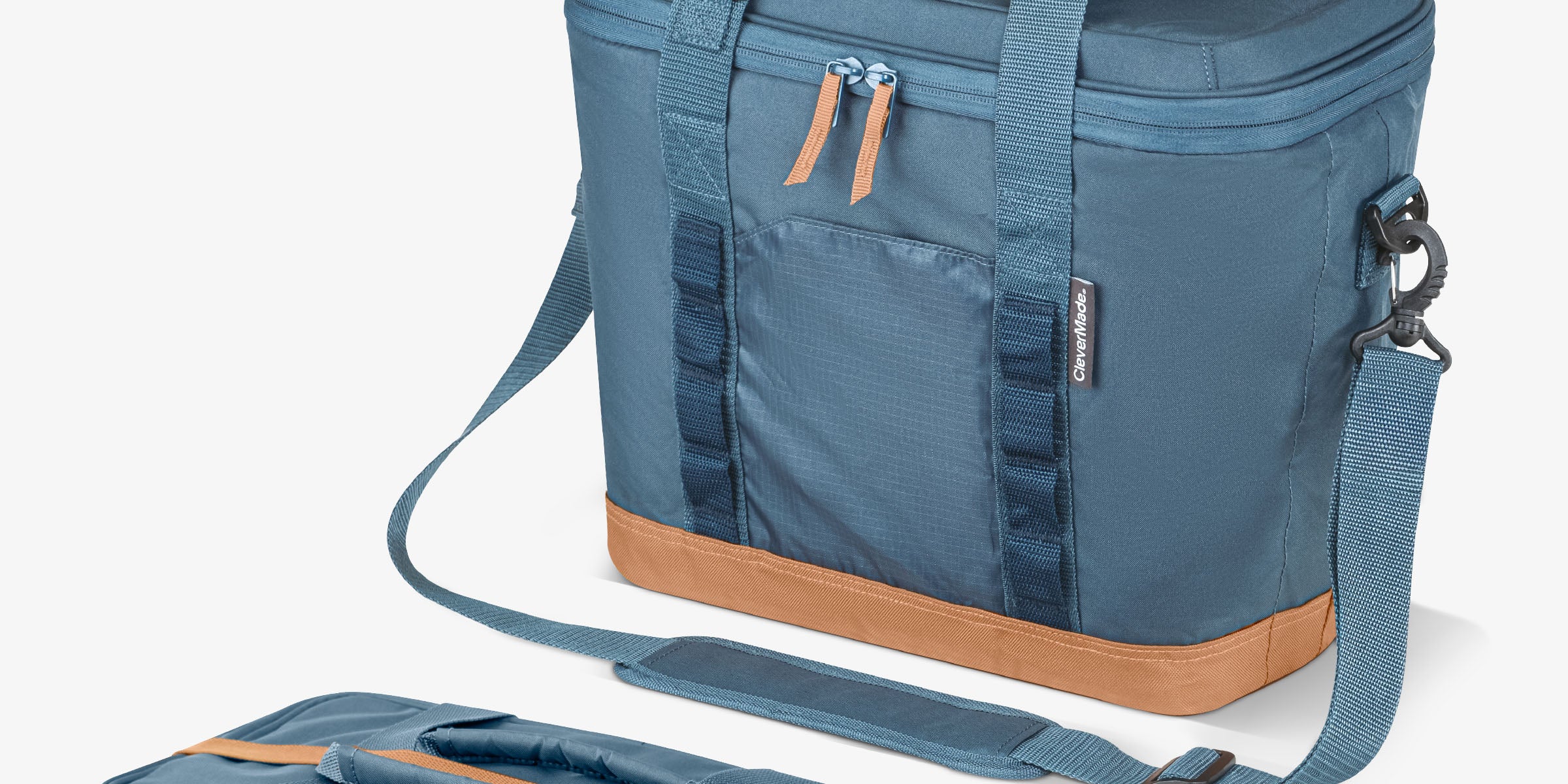 Blue cooler bag with brown accents on a white background