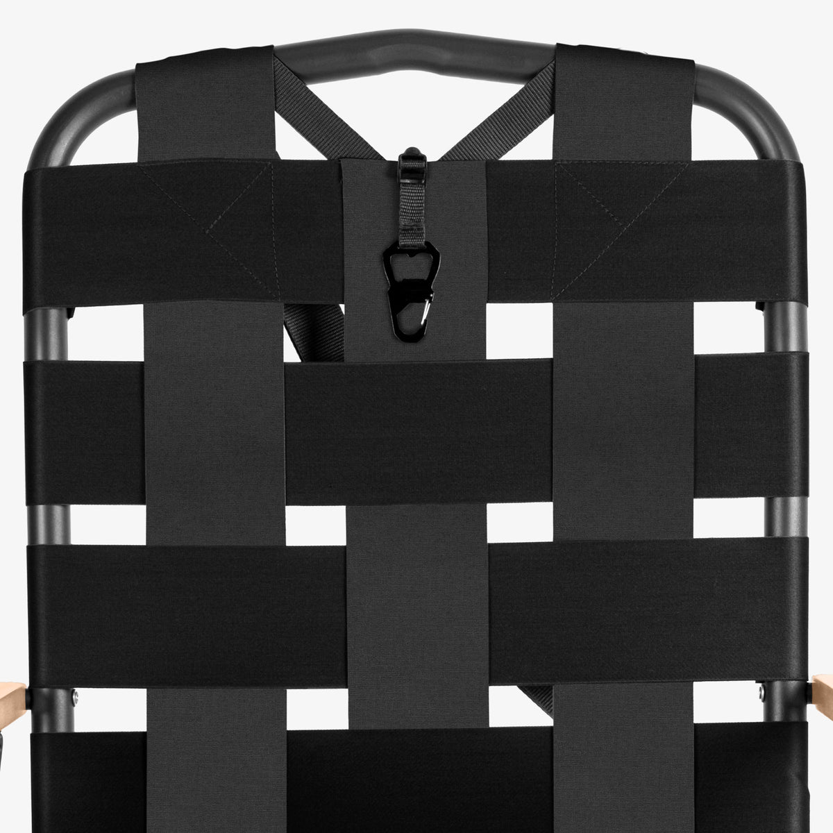Black folded Kove foldable outdoor chair on a white background on a white background