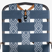 Kove foldable outdoor chair with blue patterned backrest and brown straps on a white background on a white background