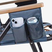 Blue Kove foldable outdoor chair with a mesh side pocket holding a phone and a can on a white background