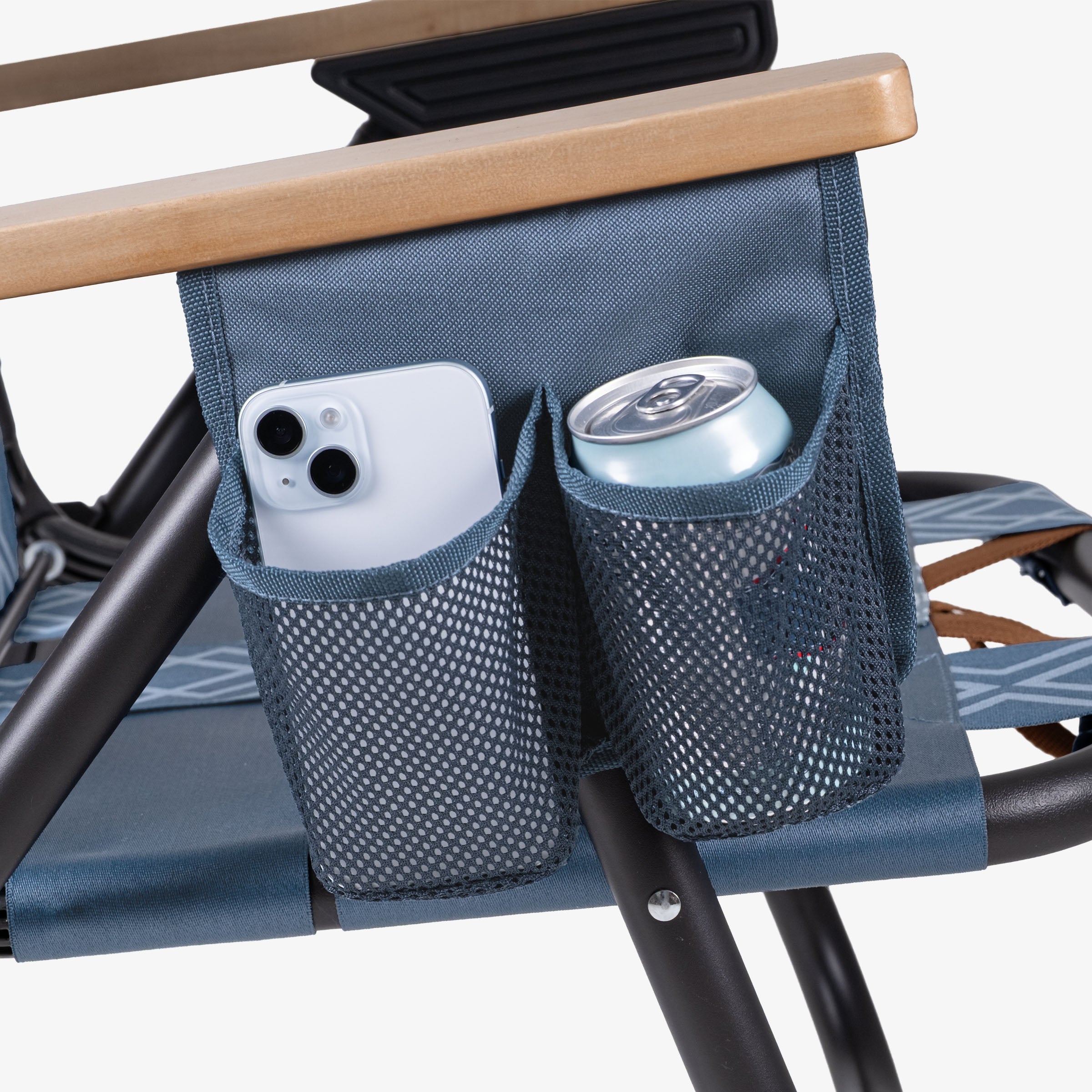 Blue Kove foldable outdoor chair with a mesh side pocket holding a phone and a can on a white background