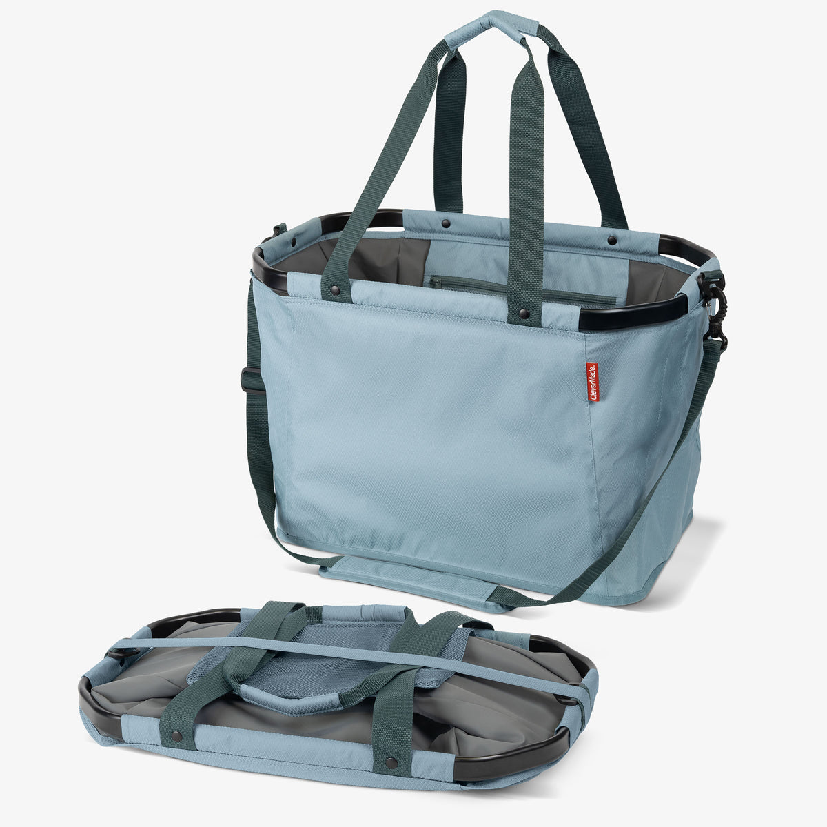 Light blue tote bag with black straps on a white background