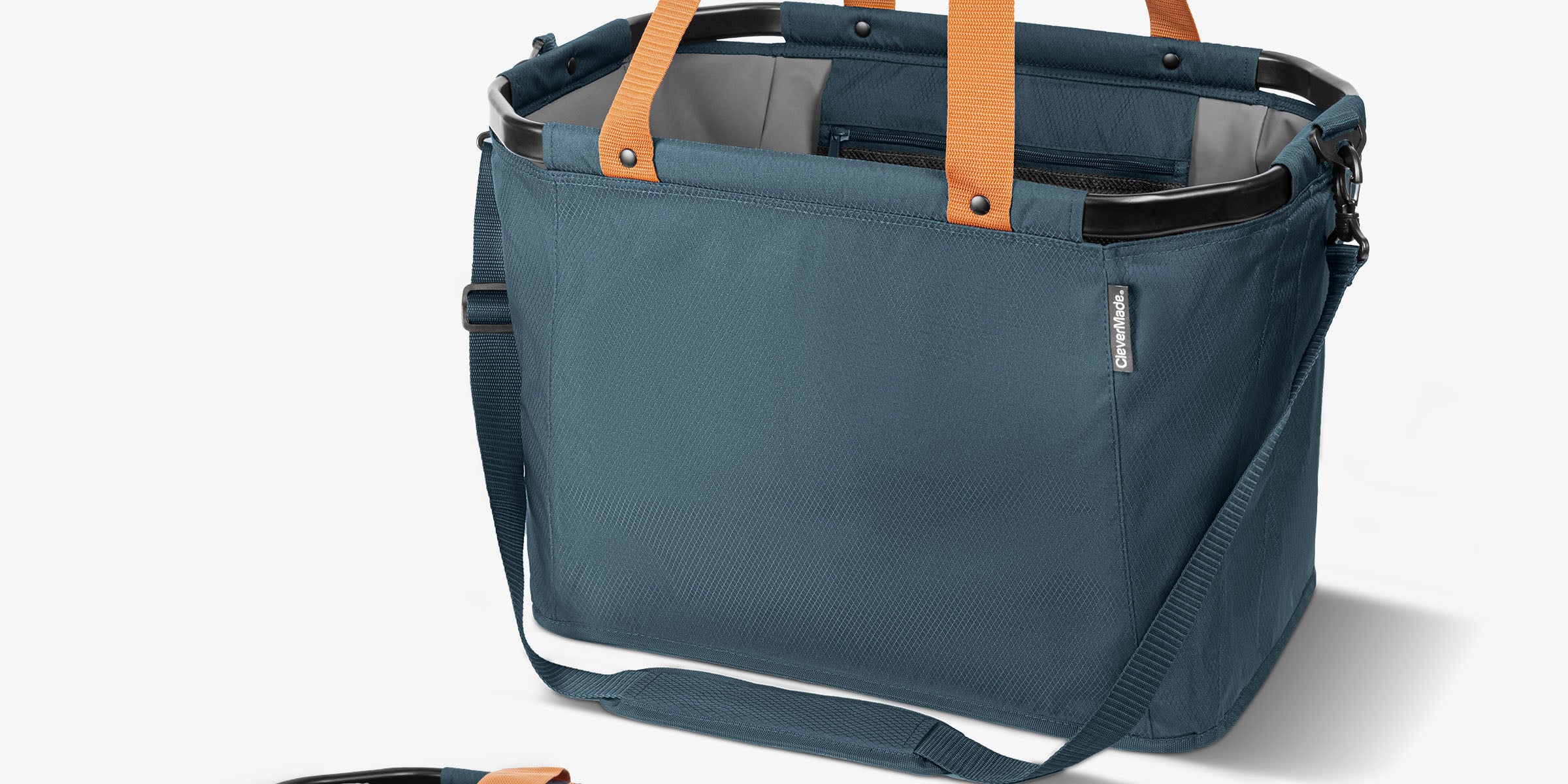 Blue tote bag with orange straps on a white background