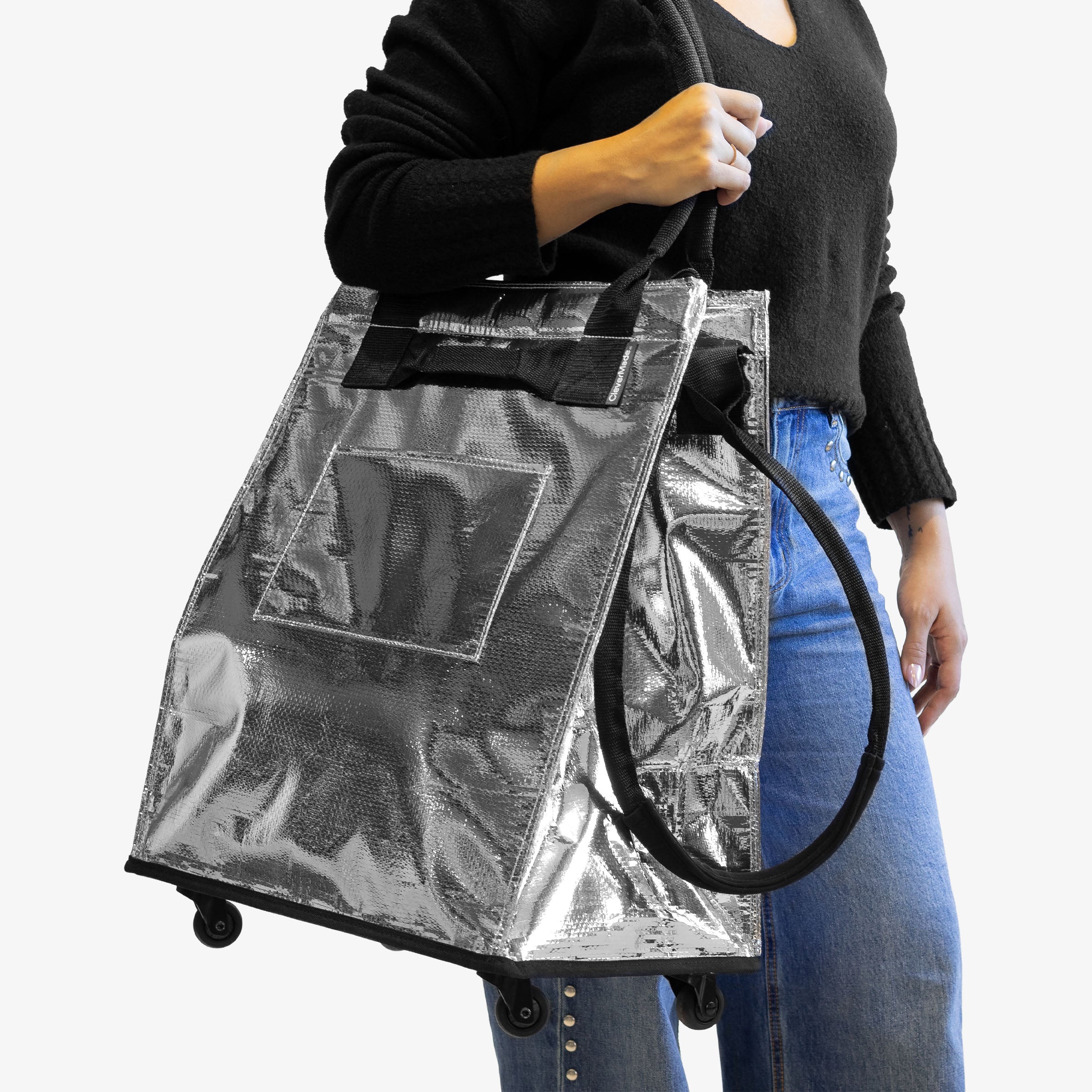 Lady Carrying 62L Silver Rolling Hauler Bag  on her Shoulder