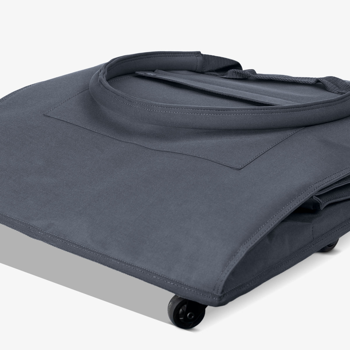 Gray fabric cover with wheels on a white background