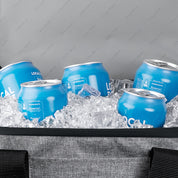 Blue cans with 'Local' branding on ice in a cooler bag.