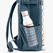 Blue backpack cooler with a water bottle in a mesh pocket on a white background