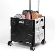 A collapsible wheeled crate with four wheels carrying bags and other stuffs